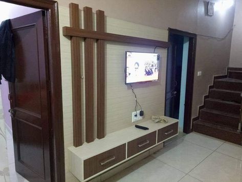 #lcd unit White and Brown combination 3pillar and very simple designs with 3 draw 7 feet height and 8 feet length you won't see more LED panel design open my Pinterest profile and follow me on Pinterest Karan Jangid thank you Lcd Unit Design, Simple Tv Unit Design, Tv Cupboard Design, Lcd Wall Design, Lcd Panel Design, Lounge Room Design, Ruang Tv, Tv Unit Furniture Design, Modern Tv Wall Units