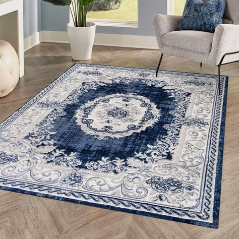 This ornate medallion rug has a scroll and floral pattern, adding modern Bohemian cottage style to a living room, bedroom, entry or kitchen. Varied tones of denim blue on an ivory background give this rug a hand-woven, rustic look. Cabin Rugs, Blue And White Wallpaper, Grey Curly Hair, Bohemian Cottage, Medallion Area Rug, Blue And White Decor, Modern Outdoor Lighting, Blue Toile, Contemporary Cottage