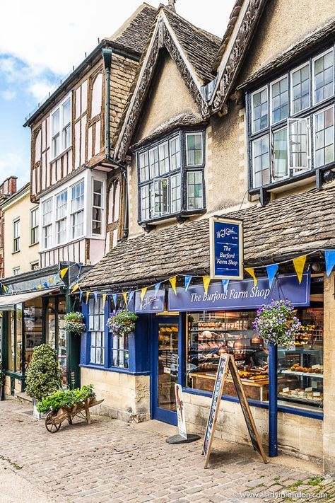 Shops on the high street in Burford, a pretty village in the Cotswolds, England. Click through for more pictures on the A Lady in London blog. #burford #cotswolds #england Burford Cotswolds, The Cotswolds England, Cotswolds Cottage, Cotswolds England, English Village, Voyage Europe, Waffle Knit Sweater, England And Scotland, The Cotswolds