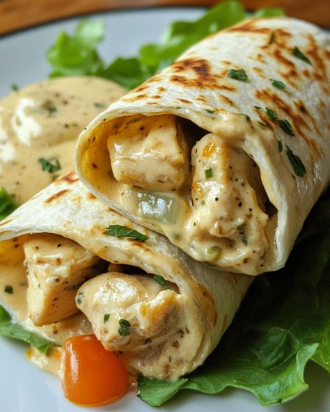 Chicken Alfredo Wraps 🌯 Ingredients: - 2 cups cooked chicken, shredded - 1 cup Alfredo sauce - 1/2 cup shredded mozzarella cheese - 4 large tortillas - 1/4 cup grated Parmesan cheese - Fresh parsley (optional) Directions: - Warm the tortillas slightly to make them flexible. - In a bowl, mix the cooked chicken with Alfredo sauce and mozzarella cheese. - Spoon the chicken mixture onto each tortilla and sprinkle Parmesan cheese on top. - Roll up the tortillas tightly to form wraps. - Grill or ... Food To Make With Tortillas, Chicken Alfredo Wraps, Chicken With Alfredo Sauce, Tortilla Ideas, Chicken Shredded, Chicken Roll Ups, Chicken Roll, Plats Healthy, Healthy Food Dishes