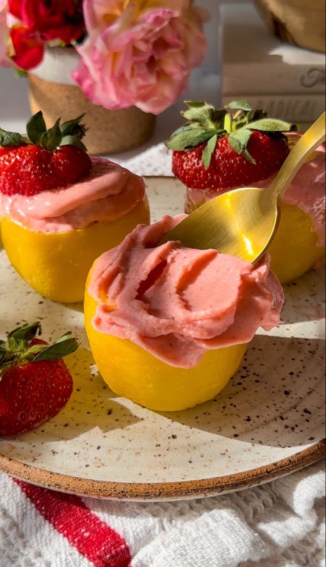 Pink Strawberry lemonade ice cream served in frozen lemon cups and topped with strawberry tops Strawberry Lemonade Ice Cream, Strawberry Lemonade Sorbet, Lemon Cups, Lemonade Ice Cream, Cream Photoshoot, Apple Pie Ice Cream, Fancy Ice Cream, Frozen Strawberry Lemonade, Strawberry Stuff