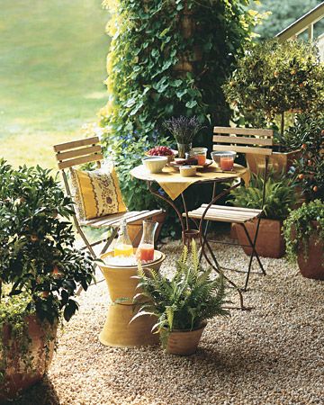 "A charming pea-gravel breakfast patio furnished with a cafe table, matching chairs... brings to mind alfresco dining in the South of France. ...Ice bucket of stacked flowerpots (the  base is upside down; water easily drains out).    http://www.marthastewart.com/274242/creative-outdoor-spaces/@Virginia Stokes/276985/outdoor-living#/170869 Pea Gravel Patio, Unique Outdoor Spaces, Bistro Chairs Outdoor, Provence Garden, Elsie De Wolfe, Gravel Patio, Pea Gravel, Landscape Architects, Bistro Set