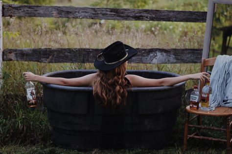 Water trough western photoshoot Trough Photoshoot, Water Trough Photoshoot, Western Photoshoot Ideas, Bath Pics, Western Photo Shoots, Just Out Of Reach, Milk Bath Photography, Western Photoshoot, Outdoor Bathtub