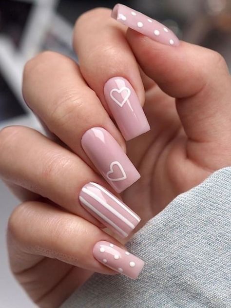 long, nude-pink acrylic nails with white hearts, stripes, and dots Nails Acrylic Dots, Double Heart Nail Design, Dots And Stripes Nails, Pink Stripe Nails, Ideje Za Nokte, Pink Heart Nail Designs, Nude Pink Nails With Design, Pink Nails With Heart, Cute Pink Nails