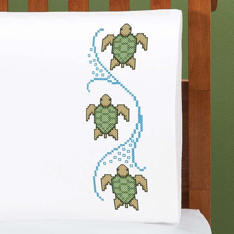 PRICES MAY VARY. Cotton,polyester These pillowcases feature a trio of sea turtles swimming in a row with swirling blue lines mimicking the ocean waves These pillowcases feature a trio of sea turtles swimming in a row with swirling blue lines mimicking the ocean waves. The design is stamped for cross-stitch on white cotton/polyester pillowcases with a hemmed edge. There are 2 pillowcases in the set, and each pillowcase is pre-finished and ready for stitching. Simply follow the easy-to-read chart Sea Turtle Cross Stitch, Turtles Swimming, Cross Stitch Sea, Graph Paper Art, Blue Lines, Cross Stitch Books, Cross Stitch Baby, Sea Turtles, Cotton Pillow Cases