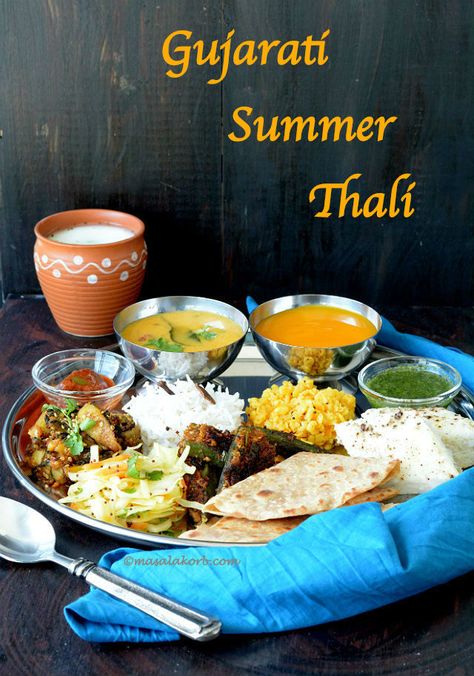 Gujarati Summer Thali includes traditional food recipes along with fresh mango pulp (aamras), which is an integral part of the meal during summer season. Gujrati Thali Recipes, Gujarati Thali Recipe, Thali Ideas, Lunch Menu Ideas, Traditional Food Recipes, Gujarati Thali, Indian Thali, Gujarati Cuisine, Indian Food Photography