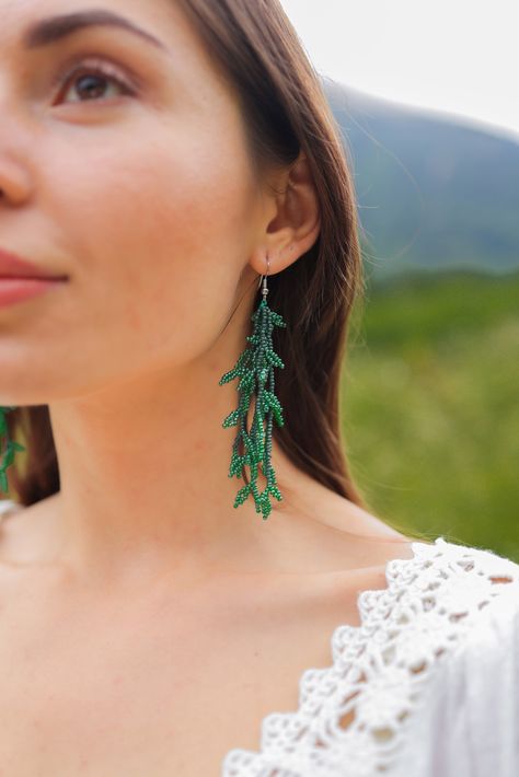 These green beaded earrings are seed bead earrings. Let add color to your face with the long leaves of this dangle earrings that only lovyatelier can offer you. Give opportunity to the perfect colors of nature with these statement earrings. Do you need a gift for her ? Here it is.  ➢Two shades of green are used. ➢All of my products are carefully handcrafted. ➢Bead sizes are 2 mm. ➢You can be sure that the seed beads I use and all my materials are of the highest quality. ➢The seed beads use never Seed Bead Leaf, Green Chandelier Earrings, Seed Bead Fringe Earrings, Bead Fringe Earrings, Beaded Leaf, Beaded Tassel Earrings, Fall Earrings, Long Dangle Earrings, Colorful Earrings