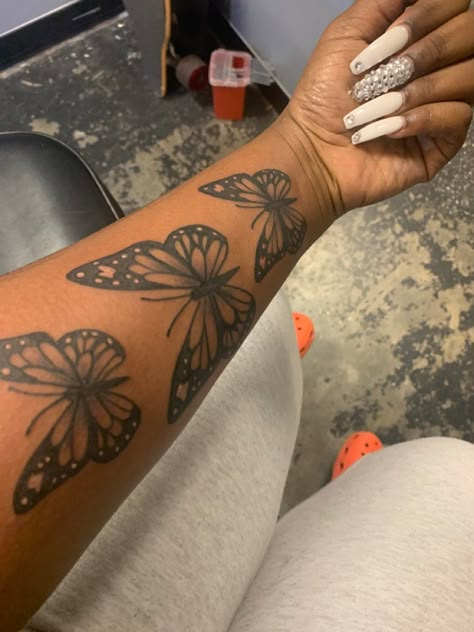 3 Butterfly Tattoos on a Darkskin Black Woman Baddie Tats Arm, Inner Forearm Tattoos For Women, Forearm Tattoo Girl, Arm Tattoos Black, Butterfly Tattoos On Arm, Cute Thigh Tattoos, Forearm Tattoo Quotes, Shoulder Sleeve Tattoos, Girl Thigh Tattoos