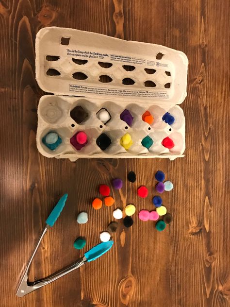 Fabulous Fun Friday - Toddler Activity - Pom Sorting Supplies Needed: Egg Carton, Colored Markers, Small Poms, Small Tongs Instructions - Color the bottom of each egg cup a different color (I used a black marker and outlined the bottom of an egg cup for the color white) Let your little one work on their fine motor skills while learning to sort by color ❤️🧡💛💚💙💜🖤🤍🤎💖 - Iowa Mom Life Egg Carton Activities, Sort By Color, Learning Games For Toddlers, Colored Markers, Fun Friday, Toddler Activity, Cup A, Games For Toddlers, Egg Carton