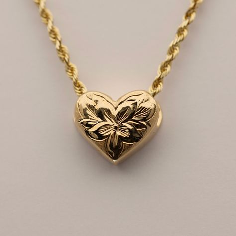 Small Hawaiian Slider Heart Pendant with Engraved Flowers. Available in four designs. Approx. 10.5mm wide. Chain sold separately. Final sale. No returns or exchanges. Item Numbers & Designs: SHP4-HL2Y-V Hibiscus Flower & Leaves in 14K Yellow GoldSHP4-HL1W-V Hibiscus Flower & Leaves in 14K White GoldSHP4-4HLW-V Four Hibiscus Flowers w/ Leaves in 14K White GoldSHP4-DPLY-V Plumeria Flower w/ Leaves & .02ct Diamond in 14K Yellow Gold Hawaiian Heirloom Jewelry, Flower Leaves, Heirlooms Jewelry, Jewelry Accessories Ideas, Dope Jewelry, Funky Jewelry, Hibiscus Flower, Jewelry Lookbook, I Love Jewelry