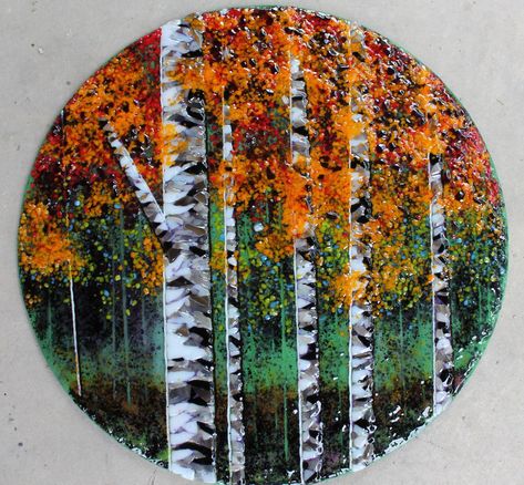 This handmade fused glass mosaic featuring birch / aspen trees is a colourful piece of landscape art. The piece is about 13 inches in diameter.  The tree trunks were a labor of love, with each tiny piece being placed individually.  (Actually, I enjoyed doing it, and didn't really want to stop.) I'm not one for long, fluffy descriptionsplease let me know if you have any questions. If you're interested, you may want to check out more of my glass art at https://www.facebook.com/SarahMillerArt/ Mosaic Art Wall, Frit Painting, Fused Glass Panel, Birch Tree Art, Fox Wall Art, Fused Glass Wall Art, Glass Fusion Ideas, Trees Landscape, Fused Glass Artwork