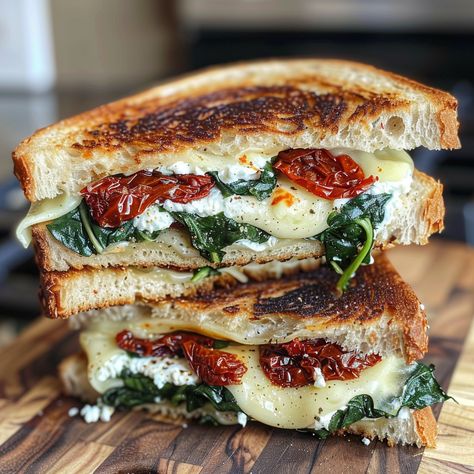 Let's be honest - is there anything more comforting and nostalgic than a classic grilled cheese sandwich? That first hot, crispy bite transports you right back to childhood. But as amazing as the original is, Spinach Dip Sandwich, Sun Dried Tomato Spinach Grilled Cheese, Tuscan Grilled Cheese, Apple Chicken Sandwich, Ciabatta Grilled Cheese, Ricotta Cheese Sandwich, Ricotta Grilled Cheese Sandwiches, Grilled Tomato Sandwich, Chibatta Sandwiches Dinners