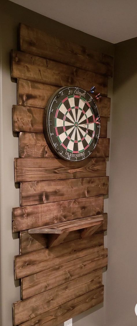 Pallet Wall Bar Ideas, Small Basement Ideas Low Ceilings Man Cave, Dart Board Wood Wall, Rustic Game Room Decor, Wood Behind Dart Board, Dart Boards Wall, Dartboard Wall Ideas, Game Shed Ideas, Garage Dart Board Ideas