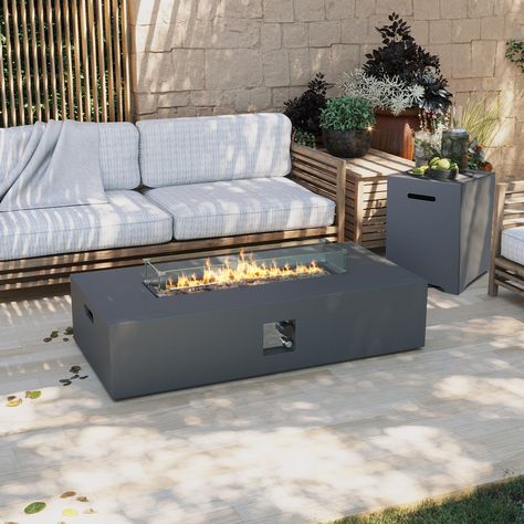 This fire pit table set will add a unique charm to your outdoor relaxation space and is an essential part of outdoor furniture. It includes a 56-inch rectangular iron fire pit table, a rectangular detachable cover, and is equipped with a propane tank. The fire pit table is made of high-quality iron metal material that has been specially treated, providing sturdy and reliable characteristics, effectively preventing rust and resisting corrosion. The included stainless steel burner offers ample hea Propane Tank Cover, Iron Fire Pit, Fire Pit Table Set, Relaxation Space, Leisure Space, Gas Fire Pit Table, Gas Fire Pit, Outside Patio, Gas Fire