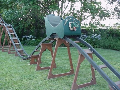 homemade roller coaster.  Now how cool would this be?? Let's build this summer! Homemade Roller Coaster, Backyard Roller Coaster, Crafts For Men, All The Bright Places, Woodworking For Kids, Backyard Playground, Backyard For Kids, Backyard Fun, Play House