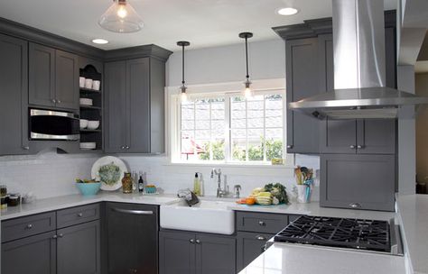 White and gray kitchen features gray shaker cabinets adorned with brushed nickel pulls alongside white quartz counters which pair with a mini subway tiled backsplash highlighted by dark gray grout. Description from decorpad.com. I searched for this on bing.com/images Dark Grey Cabinets, Grey Painted Kitchen, Dark Grey Kitchen Cabinets, Серая Кухня, Grey Kitchen Designs, Dark Grey Kitchen, Painted Kitchen Cabinets Colors, Gray And White Kitchen, Black Appliances