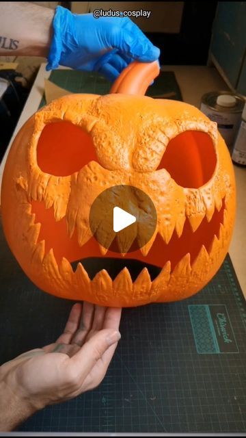 Lucas Michael Andalis on Instagram: "One of my favorite Halloween projects was customizing this plastic pumpkin decoration and turning it into a wearable head in 2022! I saw it in the window of a party shop and my brain went...hmm hello there 😏 Here is some WIP on how I customized it, bringing to life my own version of Jack O Lantern! I drew out the face I wanted using a marker, last time I was surprisingly asked why I "painted it black" if I was going to cut the pieces away...well I just blocked out the shape so I could get an idea of what it would look like with the eyes and mouth when I add the black mesh! For the extra details, I sculpted some brows, built up around the nose and bulked up the teeth using Worbla Deco Art Beads I pigmented with acrylic paint. The beads didn't bond with Pumpkin Head Diy, How To Make A Plastic Pumpkin Scary, How To Carve Plastic Pumpkins, Melting Pumpkin Face, Pumpkin Head Mask, Laughing Pumpkin Face, Sculpted Pumpkin Faces, Jack Lantern, Jack O Lantern Faces