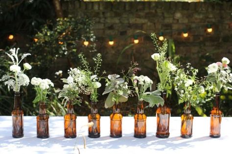 Beer Bottle Centerpieces, Beer Garden Wedding, Backyard Beer Garden, Faux Flowers Arrangements, Garden Party Ideas, Bottle Centerpieces, Brewery Wedding, Summer Garden Party, בר מצווה