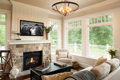 360 North Arm Lane, Orono, MN 55364 | Artisan Home Tour.  Love the chandelier and the stone with white trim and black  iron insert for the keeping room fireplace Sunroom Contemporary, Sunroom Fireplace, Small Family Room, Sarah Richardson, Shingle Style Homes, Lakeside Cottage, Hearth Room, Fireplace Remodel, Room Additions