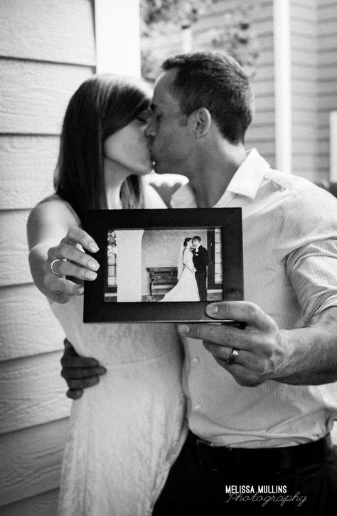 cute anniversary photo idea - couple holding wedding photo Wedding Anniversary Shoot Ideas, 5 Year Anniversary Photo Shoot Ideas, 1 Year Marriage Anniversary Photo Shoots, 25th Anniversary Picture Ideas, 5th Anniversary Photoshoot Ideas, 1st Anniversary Photo Shoot Ideas, 10th Anniversary Photo Shoot Ideas, 5 Year Anniversary Photo Shoot, 10 Year Anniversary Photo Shoot