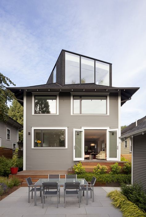 You Wouldn't Expect the Rooftop Addition on This American Foursquare in Portland #exterior #portland #addition #studio Portland Architecture, Four Square Homes, Modern Residential Architecture, Wood Facade, Brick Facade, Wood Patio, Built In Bench, Outdoor Wood, Patio Stones