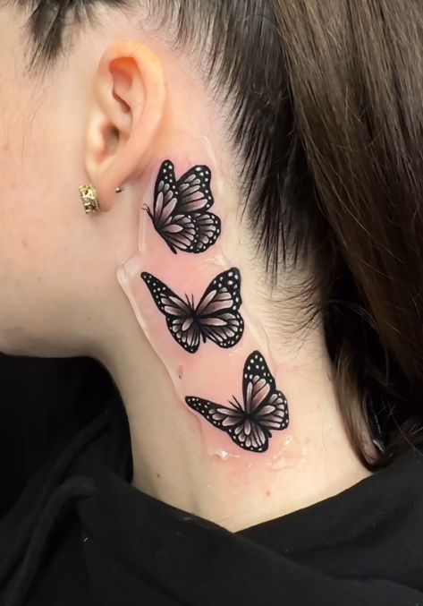 3 Butterflies Behind Ear Tattoo, Shaded Neck Tattoos, Butterflies Behind Ear Tattoo, Angles Tattoos, Tattoo Am Hals, Throat Tattoos Women Simple, Neck Tattoos Women Side, Small Tattoo Behind Ear, Neck Butterfly Tattoo