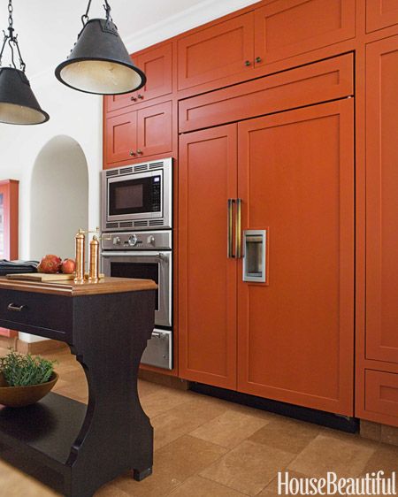 Custom pulls in unlacquered bronze have the right heft for the 48-inch Sub-Zero refrigerator doors. Burnt Orange Kitchen, Orange Cabinets, Orange Kitchen Decor, Two Tone Kitchen Cabinets, Two Tone Kitchen, Orange Kitchen, Kitchen Cabinet Colors, Steel House, Kitchen Doors