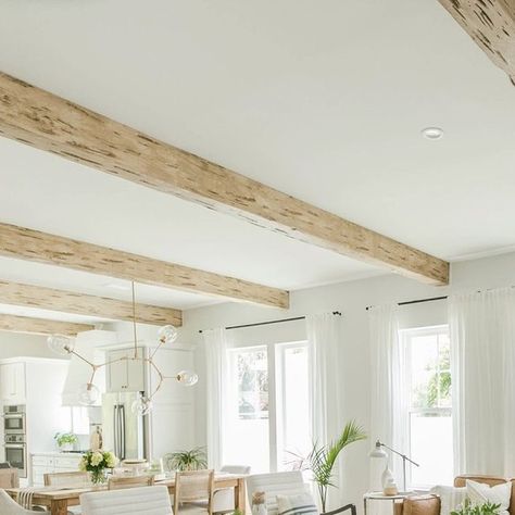 Ekena Millwork on Instagram: "Ekena Millwork’s line of faux wood ceiling beams is the perfect solution for bringing a sense of rustic elegance to your home. These beams are made of high-density polyurethane, but they have the aesthetic appeal of being made of real wood. Because polyurethane is a synthetic material, these beams come without the associated costs or upkeep of real wood.  Texture: Pecky Cypress Linked in bio!!  #livingroom #livingroomdesign #rustic #rusticdesign #fauxbeams #rusticfauxbeams #rusticwood #fauxrusticwood #interiordesign #interiordecor" White Wood Beams On Ceiling, Pecky Cypress Beams, White Oak Beams, Wood Ceiling Beams, Faux Wood Ceiling, Exposed Beams Ceiling, Pecky Cypress, Faux Beams, Wood Beam Ceiling