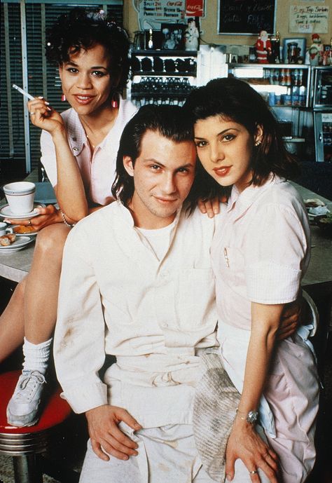 "Untamed Heart" promo still, 1993.  L to R: Rosie Perez, Christian Slater, Marisa Tomei.  PLOT: A waitress (Tomei) and her co-worker (Perez) hardly notice a shy busboy (Slater).  Tomei's character is attacked and the busboy comes to her rescue, starting a relationship. Marissa Tomei, Rosie Perez, Untamed Heart, Little Dorrit, Marisa Tomei, Christian Slater, Love Movie, Great Movies, Shirt Ideas