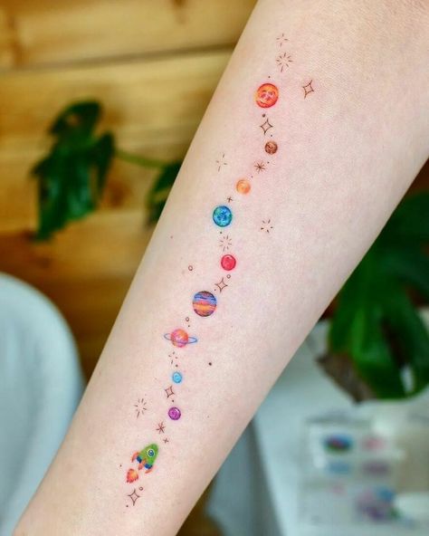 Tiny Planets And Rocket Arm Tattoo Space Arm Tattoo, Small Colorful Tattoos, Planet Tattoo, Rocket Tattoo, Space Tattoos, Female Tattoos, Planet Tattoos, Intricate Tattoo, Cute Little Tattoos