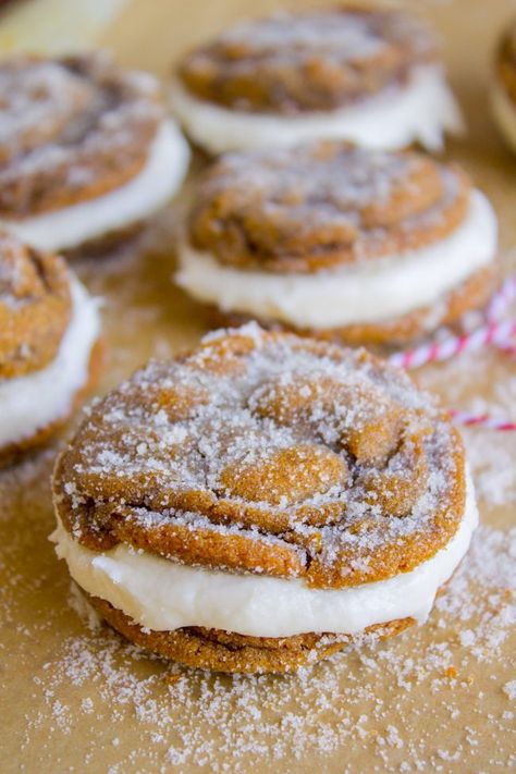 Ginger Molasses Sandwich Cookies with Buttercream Frosting from The Food Charlatan. You thought Ginger Molasses Cookies couldn't get any better, but you were wrong. Smash them together with a thick schmear of vanilla buttercream frosting and they turn into Ginger Molasses Sandwich Cookies, my favorite Christmas cookie! They are soft and perfect. #christmas #recipes #filling #buttercream #frosting #vanilla #cookie #molasses #ginger #spiced #Christmascookie #soft #easy #chewy #oldfashioned #best Molasses Sandwich Cookies, Cookbook Inspiration, Cookies With Buttercream Frosting, Ginger Molasses, The Food Charlatan, Winter Baking, Cookie Sandwiches, Whoopie Pie, Cookie Bakery