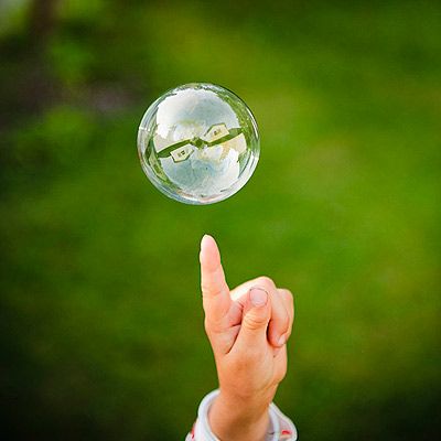 Add 1 cup of dishwashing soap to a gallon of warm water. An extra two to three tablespoons of glycerin, is the secret to super-big bubbles. Pour your concoction into a flat, rimmed tray, like a sheet-cake pan. Make a wand by bending a wire hanger into a loop. Teach your toddler to lift the wand slowly and walk backward to let loose a gigantic bubble. You can experiment with making different kinds of wands with straws, pipe cleaners, even fly swatters. Diy Bubbles, Outdoor Science, Bubble Making, Silly Monsters, Outside Fun, Fly Swatters, Outdoor Activities For Toddlers, Bubble Solution, Toy Diy