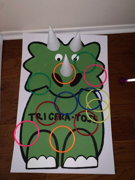 Dinasour Birthday Activities, Dinosaur Ring Toss, Diy Pin The Tail On The Dinosaur, Diy Dinosaur Party Games, Triceratops Game, Pin The Tail On The Dinosaur, Dinosaur Gross Motor Activities, Dinosaur Games For Kids Party Ideas, Vbs Dinosaur Theme