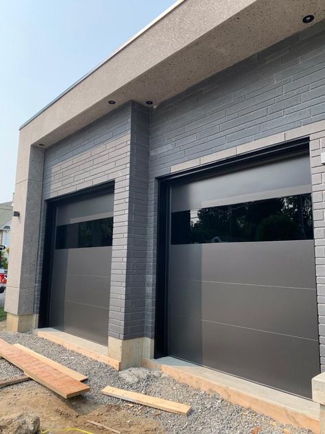 Popular Garage Doors, Modern Garage Doors Wood, Garage Doors Transitional Style, Modern Steel Garage Door, Modern Double Garage Doors, Black Modern Garage Door, Garage Expansion Ideas, Luxury Garage Doors, Modern Garage Doors With Windows