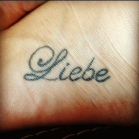 My first Tattoo. It means "Love" in german which is my first language. My Mom and sister have the same tattoo which means the world to me. Tattoos In German, German Tatoos, German Tattoos For Women, Germany Tattoo Ideas, German Tattoo Ideas For Women, German Crafts, Language Tattoos, Body Journal, German Symbols