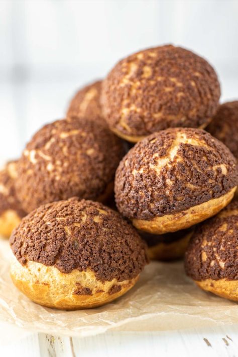 These chocolate cream puffs are filled with a rich and tasty chocolate pastry cream, which gets added crunch from a simple chocolate craquelin on top. #chocolatecreampuffs #creampuffs #creampuffsrecipe #profiteroles | chiselandfork.com Chocolate Craquelin, Chocolate Cream Puff Filling, Filled Cream Puffs, Chocolate Cream Puffs, Chocolate Pastry Cream, Profiteroles Recipe, Cream Puffs Recipe, Puff Pastry Recipes Savory, Cream Puff Cakes