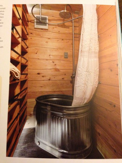 The storage on the left is actually the back of a door. Tub is a galvanized feeding trough from a farm store. This is in a container home! Skoolie Bathroom, Galvanized Bathtub, Trough Bathtub, Brain Bleed, Cowboy Bathroom, Bathtub Ideas, Feeding Trough, Portable Bathtub, Trailer Conversion