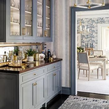 Caribbean Blue Pantry with Antiqued Mirrored Backsplash Panels - Transitional - Kitchen Grey Striped Wallpaper, Pantry Wallpaper, Blue Boys Bedroom, Brown Headboard, Houston Houses, Living Room Mantel, Creative Flooring, Pantry Doors, Glass Front Cabinets