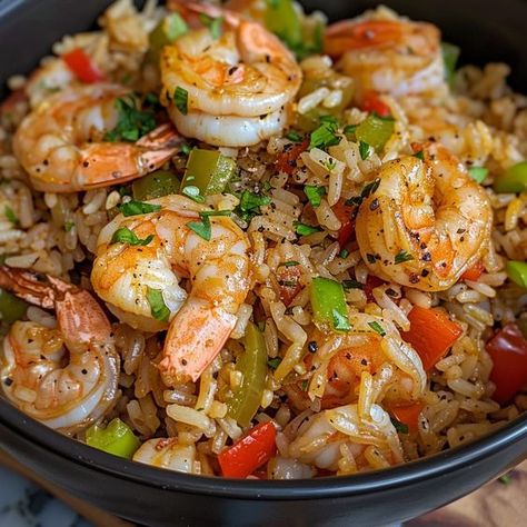 🍤 Shrimp Dirty Rice: A savory, spicy meal with a seafood twist! #SpicyShrimpRice Shrimp Dirty Rice Ingredients: Shrimp, peeled (1 lb (450 g)) Rice, cooked (2 cups (370 g)) Bell pepper, diced (1) Onion, diced (1) Celery, chopped (1/2 cup (60 g)) Cajun seasoning (1 tbsp (15 g)) Chicken broth (1/2 cup (120 ml)) Instructions: Sauté bell pepper, onion, and celery. Add shrimp and Cajun seasoning, cook until shrimp are pink. Stir in rice and chicken broth, heat through. 🌶️ Dive into the bold fla... Rice And Chicken Broth, Twist Recipes, Rice And Chicken, Dirty Rice, Shrimp And Rice, Shrimp Recipes For Dinner, Shrimp Recipes Easy, Rice Ingredients, Healthy Food Dishes