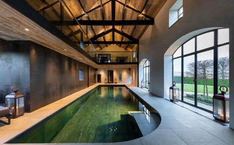 Striking wooden cladding adorns the huge vaulted ceiling in this exceptional private residence. Providing an extra dimension to this striking space... Barn Pool House, Bronze Doors, Barn Pool, Wooden Cladding, Indoor Pool Design, Wood Cladding, Flooring Projects, Beautiful Pools, Indoor Swimming