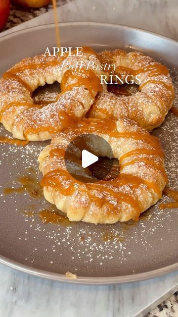 Mary Castro on Instagram: "APPLE PUFF PASTRY RINGS 🍎 - these are a fun way to use up those Fall apples and they’re absolutely delicious!

Ingredients:

1 sheet of puff pastry 
1-2 apples (I used Granny Smith and Honeycrisp)
Heavy cream (for brushing on the rings)
1/2 Tbsp cinnamon 
1/4 cup of sugar 
Optional:
Powdered sugar
Caramel sauce
Ice cream 

1. Preheat oven to 400F
2. Make your cinnamon sugar and set aside 
3. Thaw out puff pastry sheet and roll out
4. Cut 1/2 inch strips
5. cut out rounds from your apples and use a round cookie cutter to cut out the center with the seeds 
6. Wrap each apple ring with strips of puff pastry until covered
7. Brush some heavy cream (you can use milk of your choice as well or an egg wash)
8. Dust the tops with cinnamon sugar and bake in the oven for a Puff Pastry Apple Rings, Apple Rings With Puff Pastry, Puff Pastry Apple Pie, Apple Puff Pastry, Apple Rings, Puff Pastry Sheets, Pastry Sheets, Fall Apples, Egg Wash