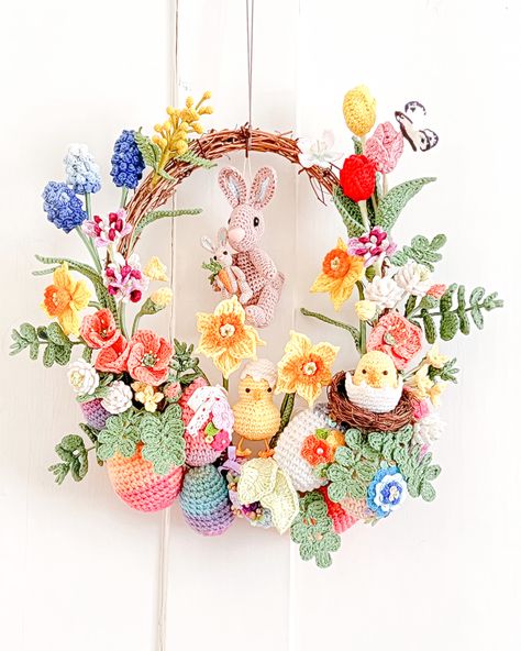 I made a crocheted spring Easter wreath. #crochetwreath #crochet flowers #crocheteaster #wreath #crochetbunny #crochetegg Spring Wreath Crochet, Easter Crochet Wreath, Crochet Spring Decor, Crochet Reef, Crochet Flower Wreath, Spring Crochet Ideas, Flower Reef, Crochet Easter Decorations, Crochet Wreath Pattern