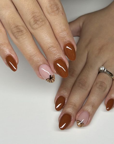 Add a twist to your manicure with perfect almond shape nails and accent nails. The accent nails with pumpkin patterns complement the rich brown base to create a cozy autumn color and a contemporary appearance. Perfect Almond Shape, Fall Almond Nails Ideas, Almond Nails Ideas, Nail Designs For Fall, Spongebob Nails, Fall Almond Nails, Holiday Nail Polish, Almond Nail Designs, Pumpkin Patterns