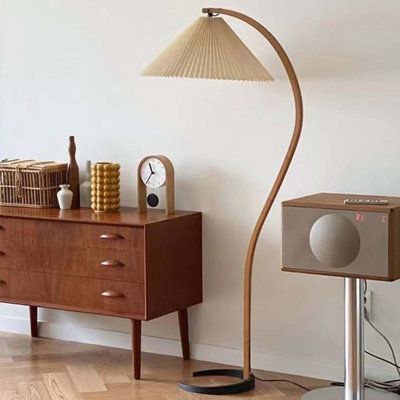 This is an S-shaped wooden floor lamp. The warm pleated lampshade brings a touch of light to cozy moments. The solid wood light body is fresh in log colour, with clear texture, natural insect-proof, moisture-proof and durable. With its artistic shape and striking colours, this lamp presents a harmonious aesthetic. | Corrigan Studio Haymes 60" Arched Floor Lamp White/Brown 60.0 x 20.0 x 13.0 in, Solid Wood | C008826077_808504383 | Wayfair Canada Wooden Floor Lamp, Metal Bedroom, Pleated Lampshade, Human Psychology, Classic Table Lamp, Floor Lamp Styles, Wooden Floor Lamps, Fitted Bedrooms, Unique Floor Lamps