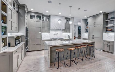 Contemporary kitchen with light gray cabinets, light wood floors and white textured backsplash Grey Wood Floors Kitchen, Light Flooring, Light Wood Flooring, Grey Kitchen Tiles, Light Grey Kitchen Cabinets, Light Wood Kitchens, Grey Kitchen Floor, Light Grey Kitchens, Hardwood Floors In Kitchen