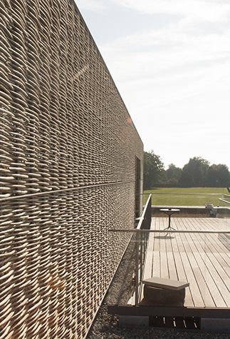 willow sticks facade weave - camp site Seehorn-Seehuus - Egnach, Switzerland - Gemperli Stauffacher - 2012 Willow Architecture, Concrete Backyard, Willow Sticks, Wood Facade, Willow Weaving, Camp Site, Facade Cladding, Architecture Board, Timber Cladding