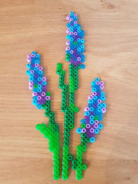 Hyacinth or Lavender flower bead perler hama pattern with stems and leaves Hama Bead Projects, Lavender Perler Beads, Pearler Bead Flower Patterns, Hama Beads Patterns Flower, Flower Perler Bead Pattern, Hama Beads Flower Pattern, Fusion Bead Ideas, Hama Bead Flowers, Perler Beads Flower Pattern