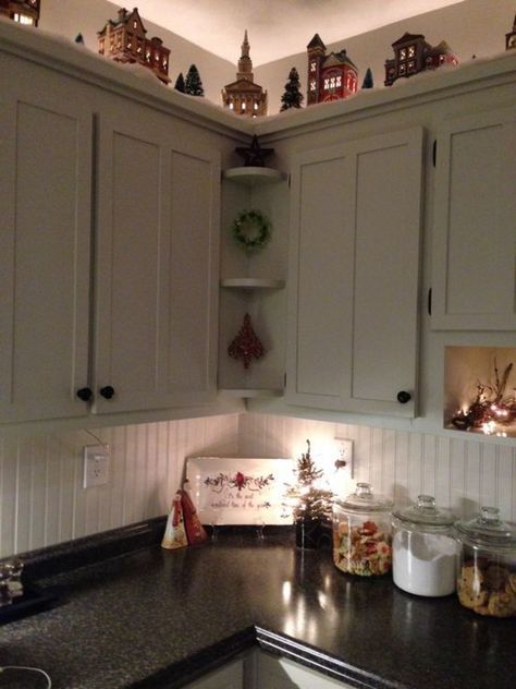 Christmas Garland On Top Of Cabinets, Christmas Village Above Cabinets, Christmas Garland Cabinets, Fall Garland Above Kitchen Cabinets, Christmas Village On Cabinets, Village Above Cabinets, Above Cabinet Christmas Village, Christmas Village Over Kitchen Cabinets, Winter Decor Above Kitchen Cabinets