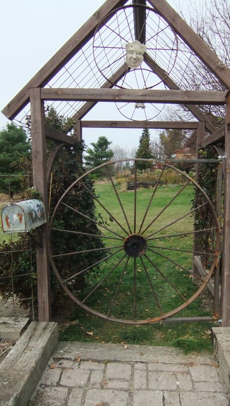 Pin by Mary Spaulding on garden ideas | Pinterest Mailbox Landscaping, Wagon Wheels, Gates And Fences, Garden Door, Metal Gates, Garden Vines, Diy Fence, Garden Entrance, Door Art