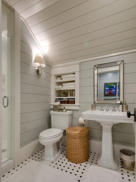 HGTV loves this bathroom with shiplap walls and large pedestal sink. Shiplap Bathroom Ceiling And Walls, Shiplap Angled Ceiling, Shiplap Angled Wall, Shiplap On Walls And Ceiling, Shiplap On Angled Ceiling, Vaulted Ceiling Bathroom Small, Bathroom Angled Ceiling, Large Shiplap Wall, Shiplap Wall And Ceiling